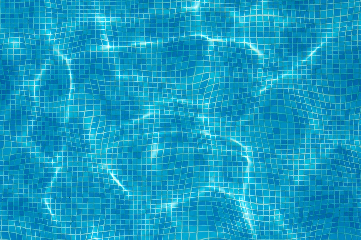Clean, clear blue water of a residential swimming pool